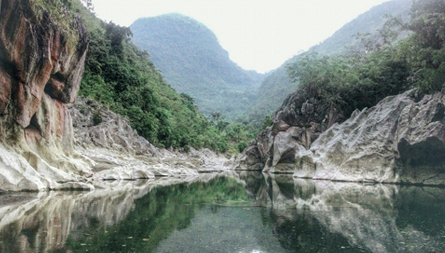 <br/><h3 class='text-white'>Mt. Daraitan, Tanay, Rizal</h3>
                          <br/><br/>
                          one of the main attractions here is Tinipak River, one of the country’s cleanest, free-flowing rivers, surrounded by large marble rocks that are great for bouldering. After descending from the summit, hikers usually continue the trek to Tinipak Rocks and walk to the river on the other side of the village. The river’s sparkling waters and majestic white rocks and cliffs that border it are almost surreal. Visitors can choose to swim in the river or if they have time, visit the cave pool for a swim.
                          
                          